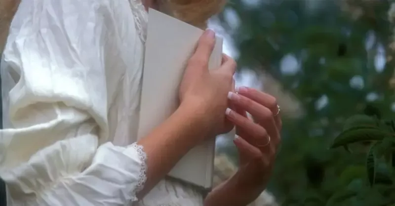 48252-woman-holding-hymnal-1200.1200w.tn.webp