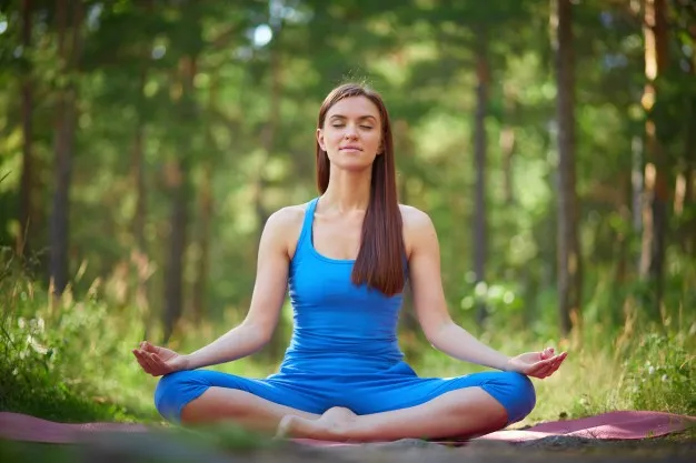 woman-in-lotus-pose-in-the-park_1098-1392.jpg