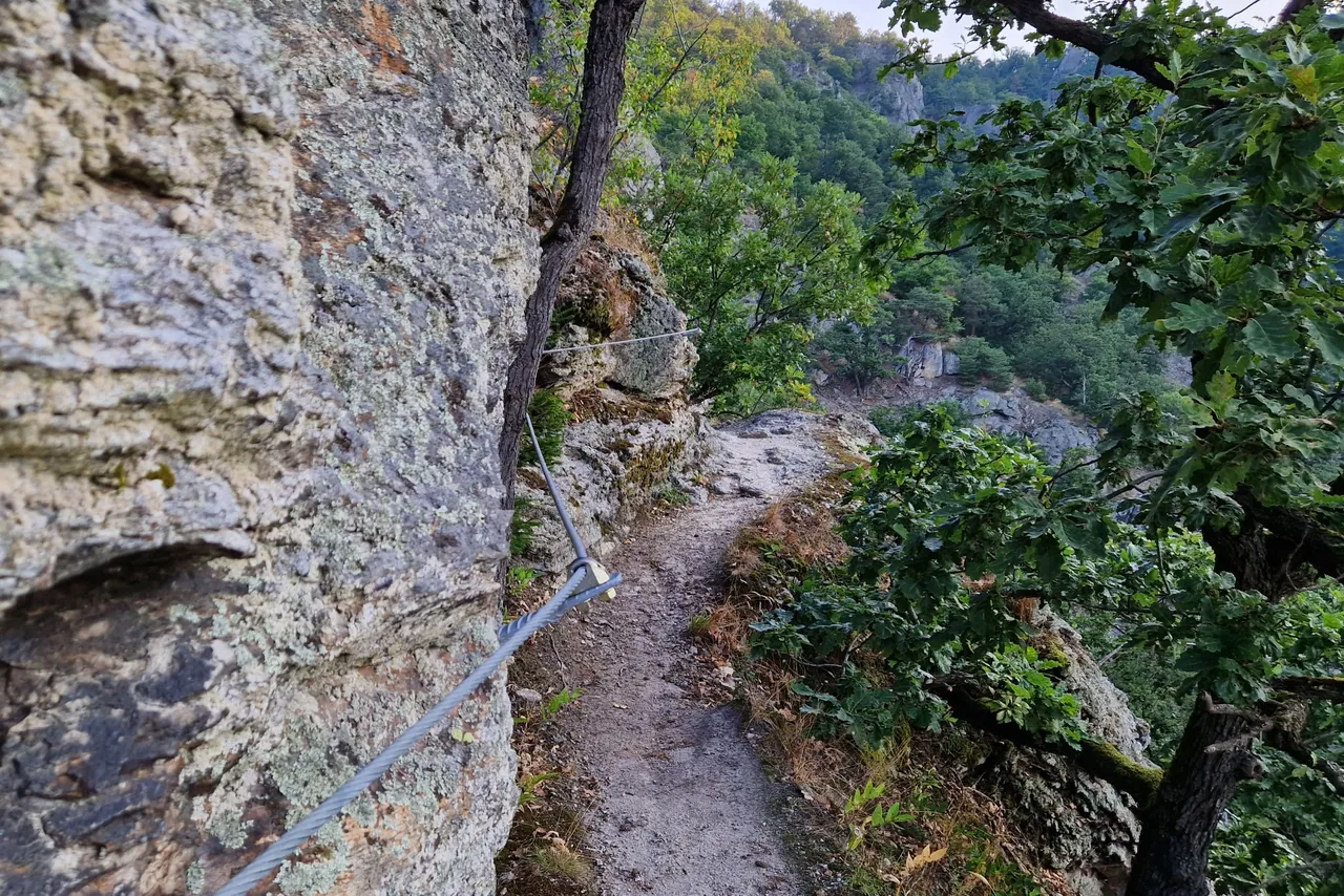 Later the path becomes narrower and is secured with iron ropes.