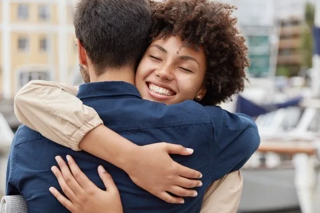 delighted_happy_smiling_african_american_woman_says_goodbye_boyfriend_gives_warm_hug_273609_18731.jpg