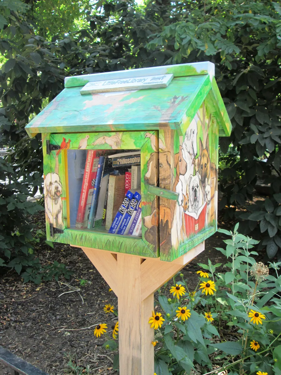 A very cute, hand painted, Little Free Library