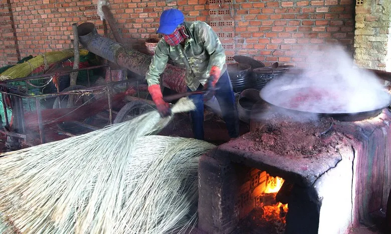 a man is drying straws