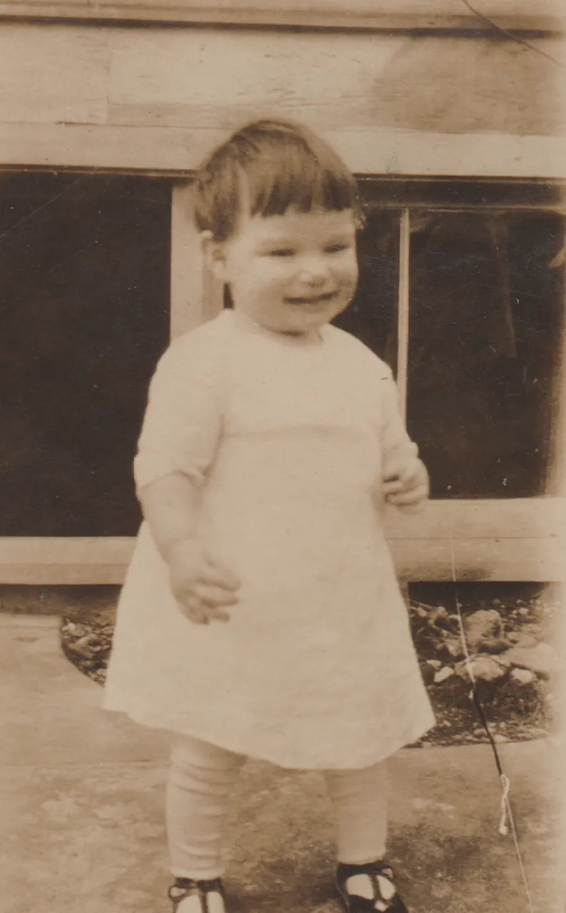 1930 - Dwana Pickett, apx year, born in 1927, less than five in these photos is my guess, one is of an Easter basket, as in eggs-3 - White dress.png