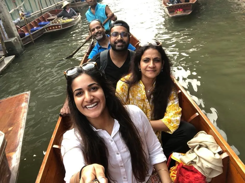 Image may contain: 4 people, people smiling, outdoor and water