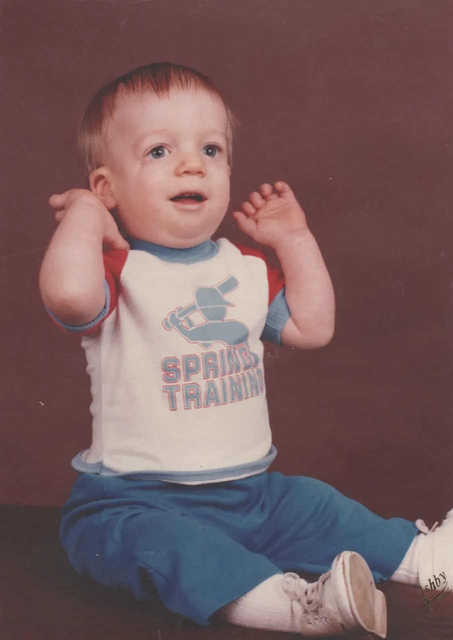 1983-04 - Rick in Spring Training Shirt, Spring of 83, I guess it was in April cuz it says he is 14months old, 1pic.png
