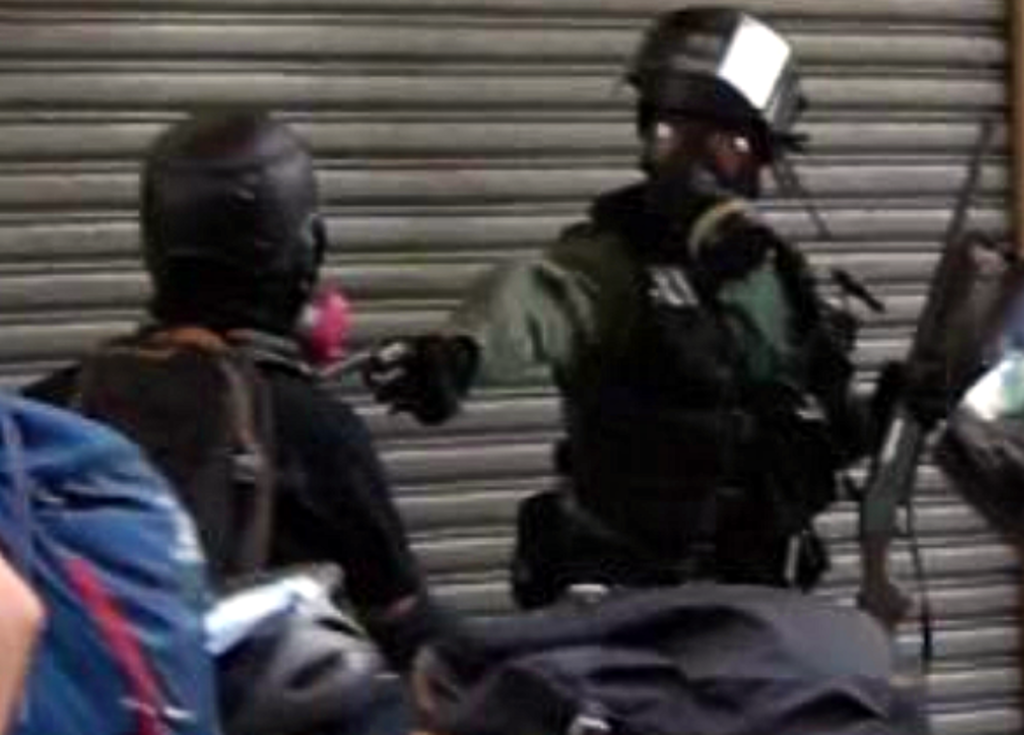 hkCopShootingProtester.png
