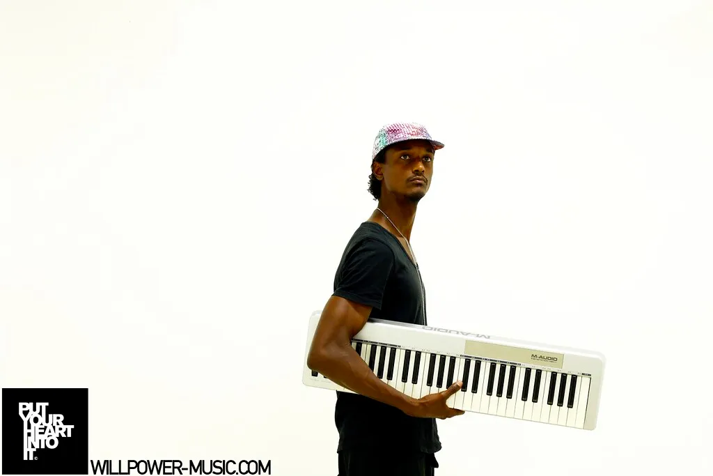 Holding my keyboard: WILLPOWER MUSIC