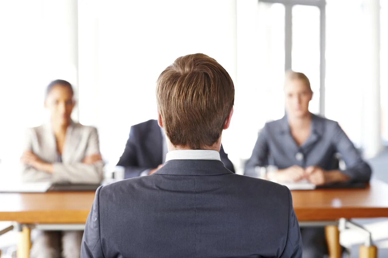 young-man-job-interview-rear-view.jpg