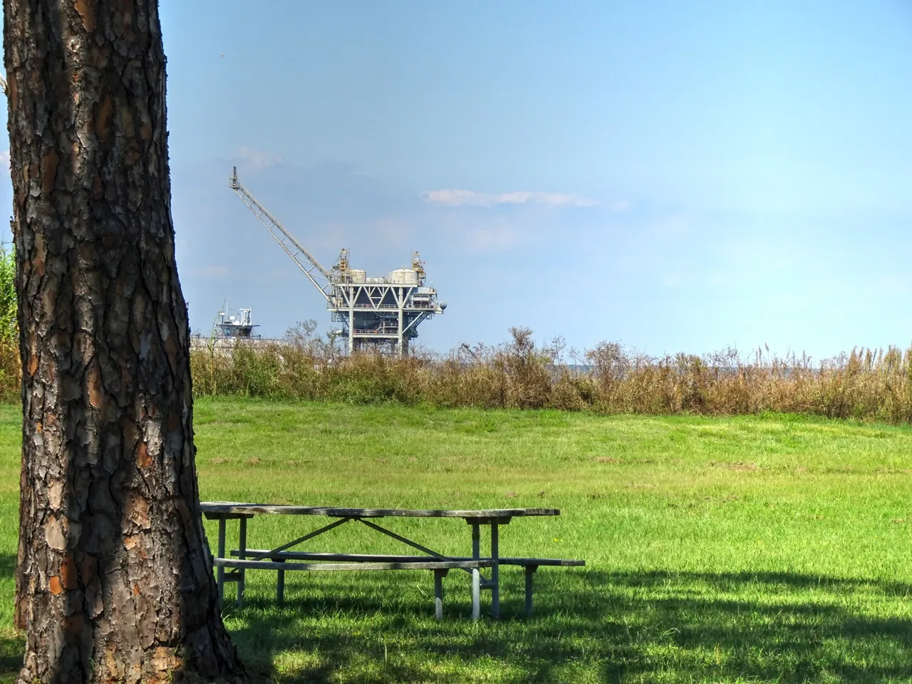 Near the shoreline are a few of oil rigs