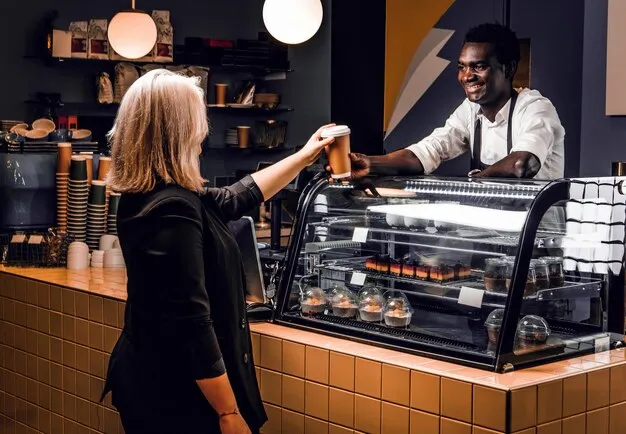 friendly-african-barista-gives-ordered-coffee-customer-modern-coffee-shop_613910-21579.jpg
