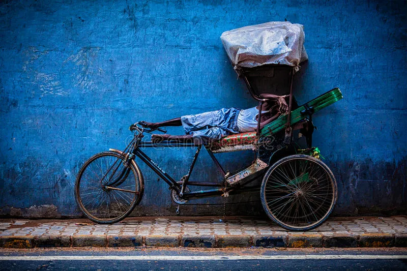 indian-cycle-rickshaw-driver-sleeps-his-bicycle-street-new-delhi-india-september-sleeping-rickshaws-were-81645241.jpg