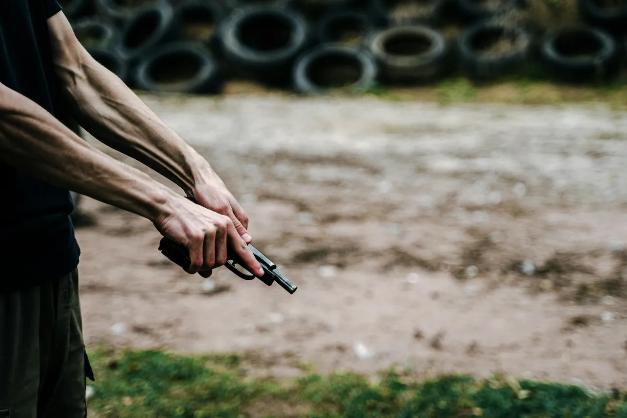 free-photo-of-man-holding-a-gun.jpeg