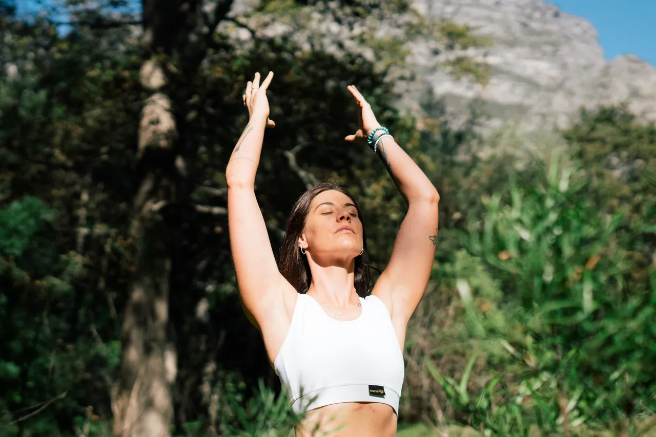 woman-in-white-tank-top-raising-her-hands-3820366.jpg