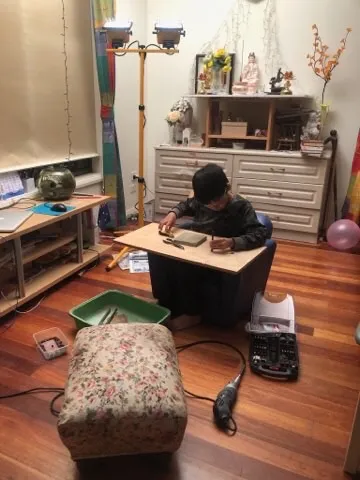 My son helping me making a seed pod shaker