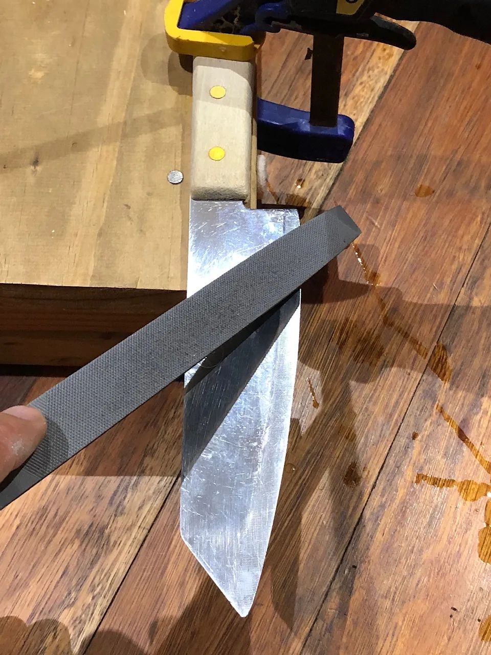 Repairing a knife with a bastard file