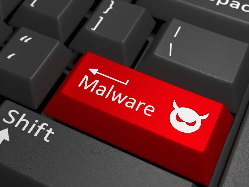 A-red-key-with-the-text-malware-on-a-black-keyboard-combined-with-a-threat-sign.-3D-Illustration.jpg