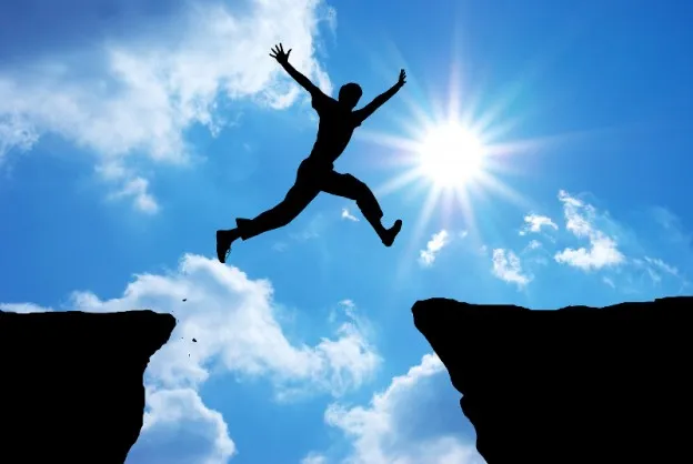 bigstock-Man-jump-through-the-gap-Elem-40996807-624x418.jpg