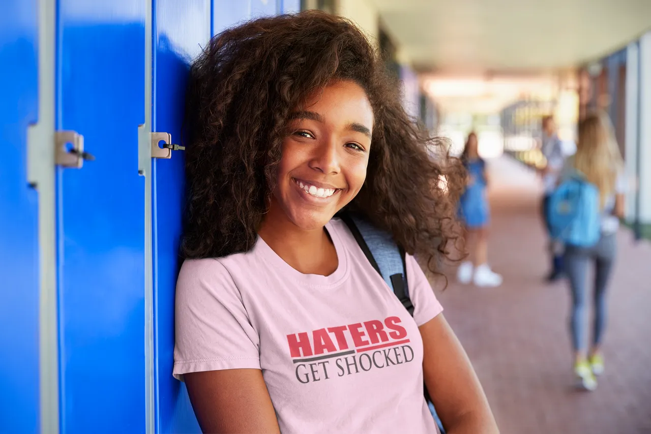 t-shirt-mockup-of-a-smiling-student-posing-by-some-lockers-34243-r-el2.png