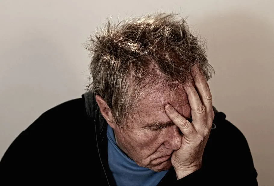 disappointedelderlyfacepalmheadache.jpg