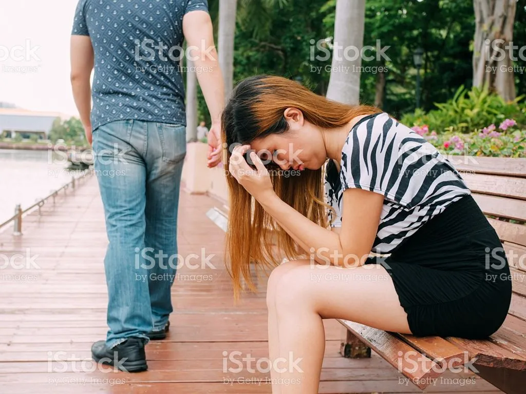 breakup-couple-with-sad-girlfriend-and-boyfriend-walking-away-picture-id544331632.jpg