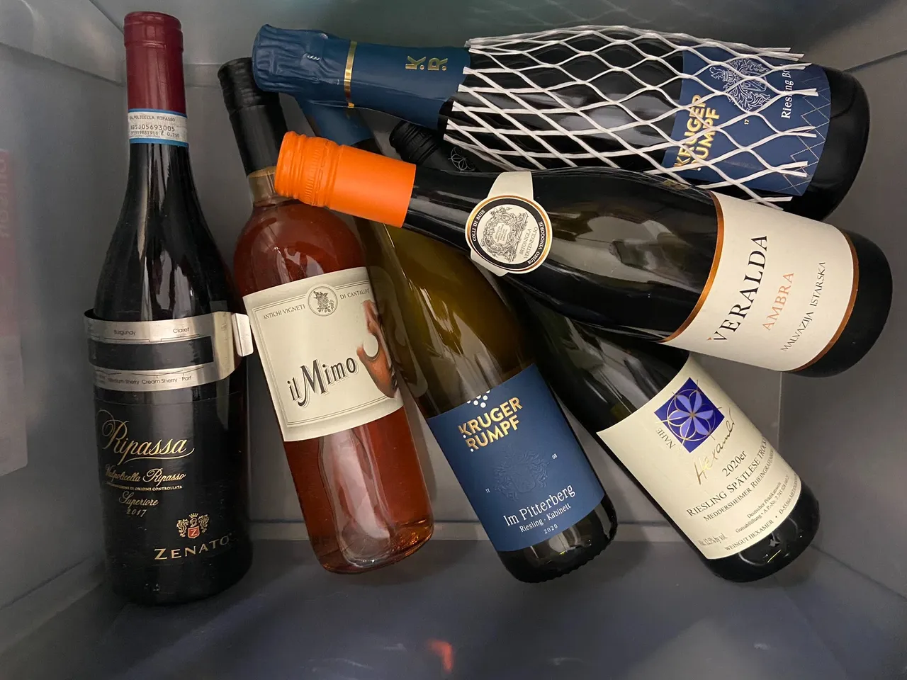 These are my stored wines. I should get a bigger box for them because they aren't laying well this way. Actually having a rosè wine. Just a few of them can be stored, and il Mimo can be stored up to three years actually. But I don't think rosé gets better on that third year. I will get myself a wine cabinet one day!