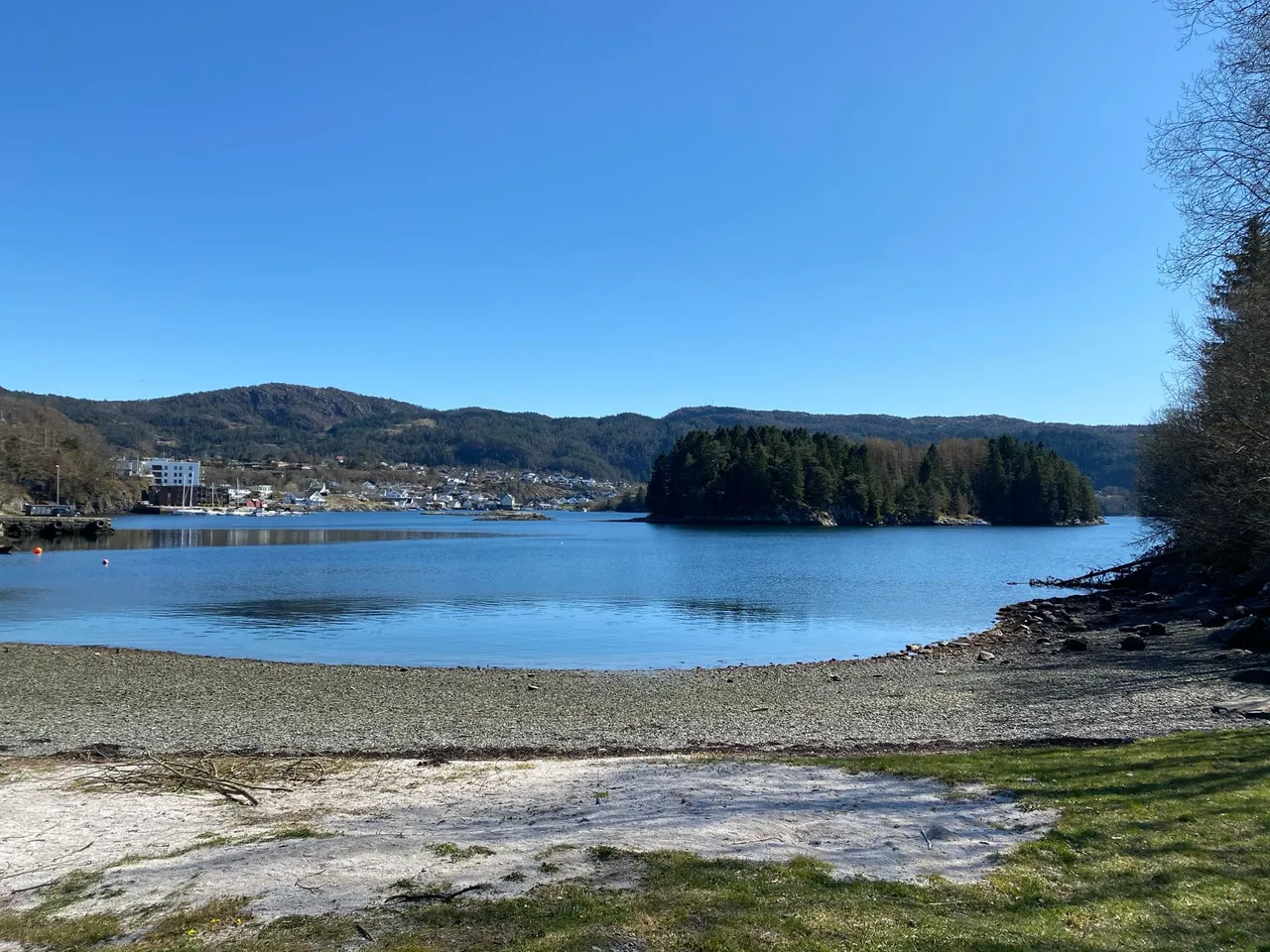 The beach. The cache is hidden in the trees to the right.