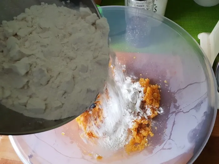 slowly mixing in the flour to the flatbread / roti