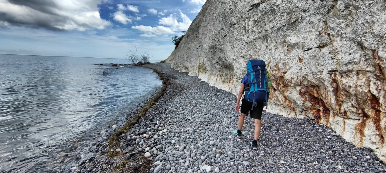 Under the cliff.