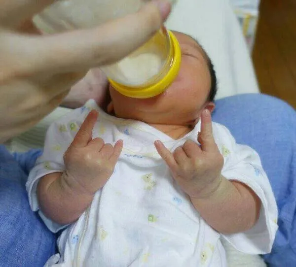 This little guy is sure enjoying that bottle. Rock on little dude!.jpg