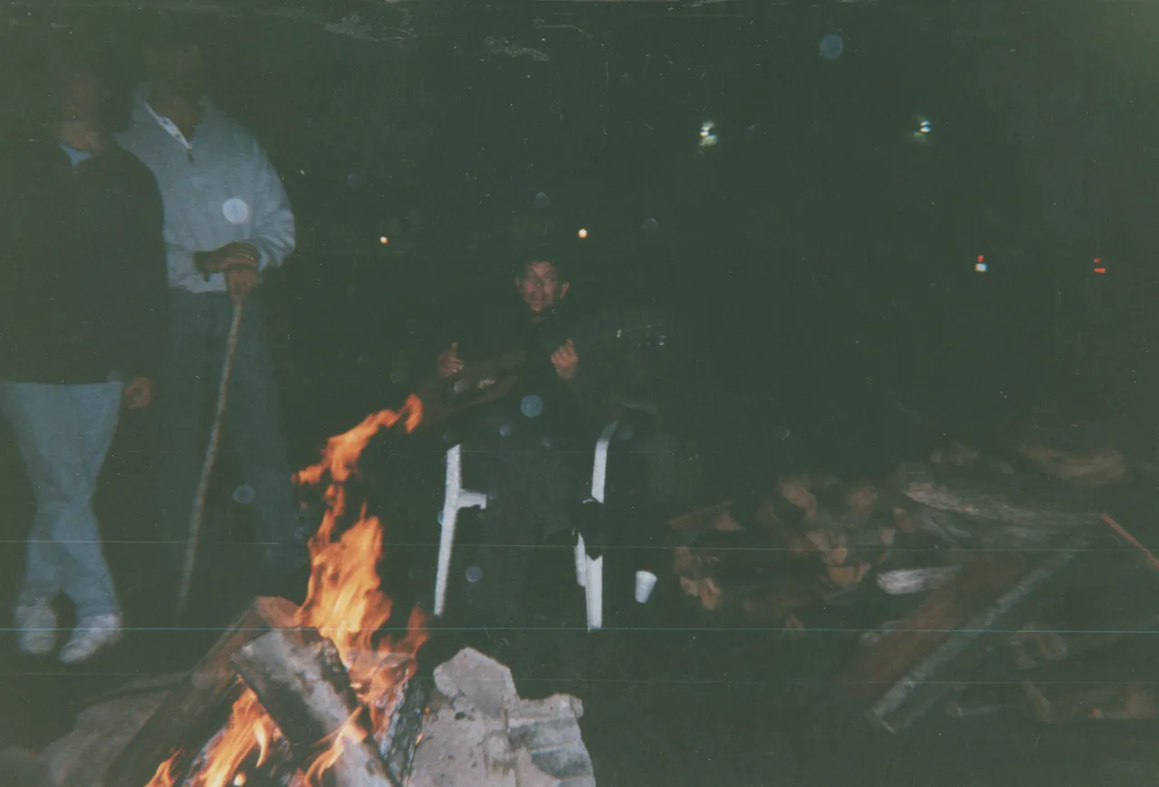 2000-07-24 apx - Reunion - Campfire - Karen, Brian, Ted Pickett, guitar.png