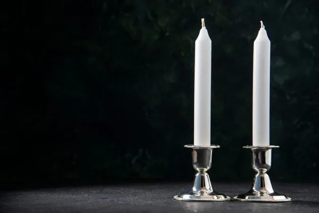 front-view-white-long-candles-dark-wall_179666-39563.jpg