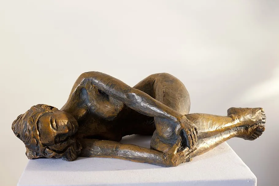 PxFuel-woman-lying-down-sculpture-india.jpg