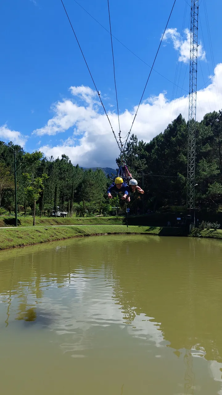 Swinging back and forth in the air.