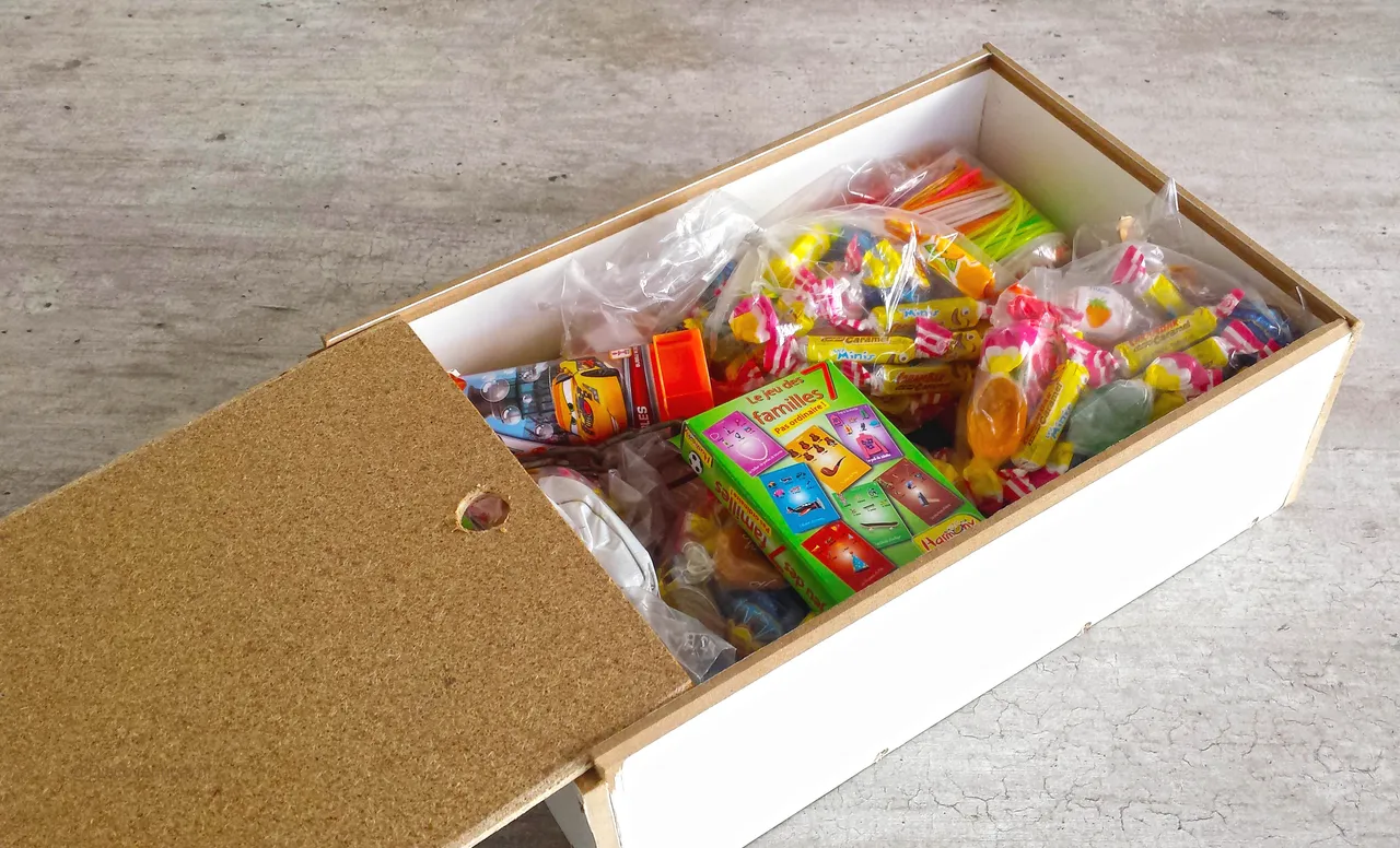 Treasure hunt box filled with games, candies and coins