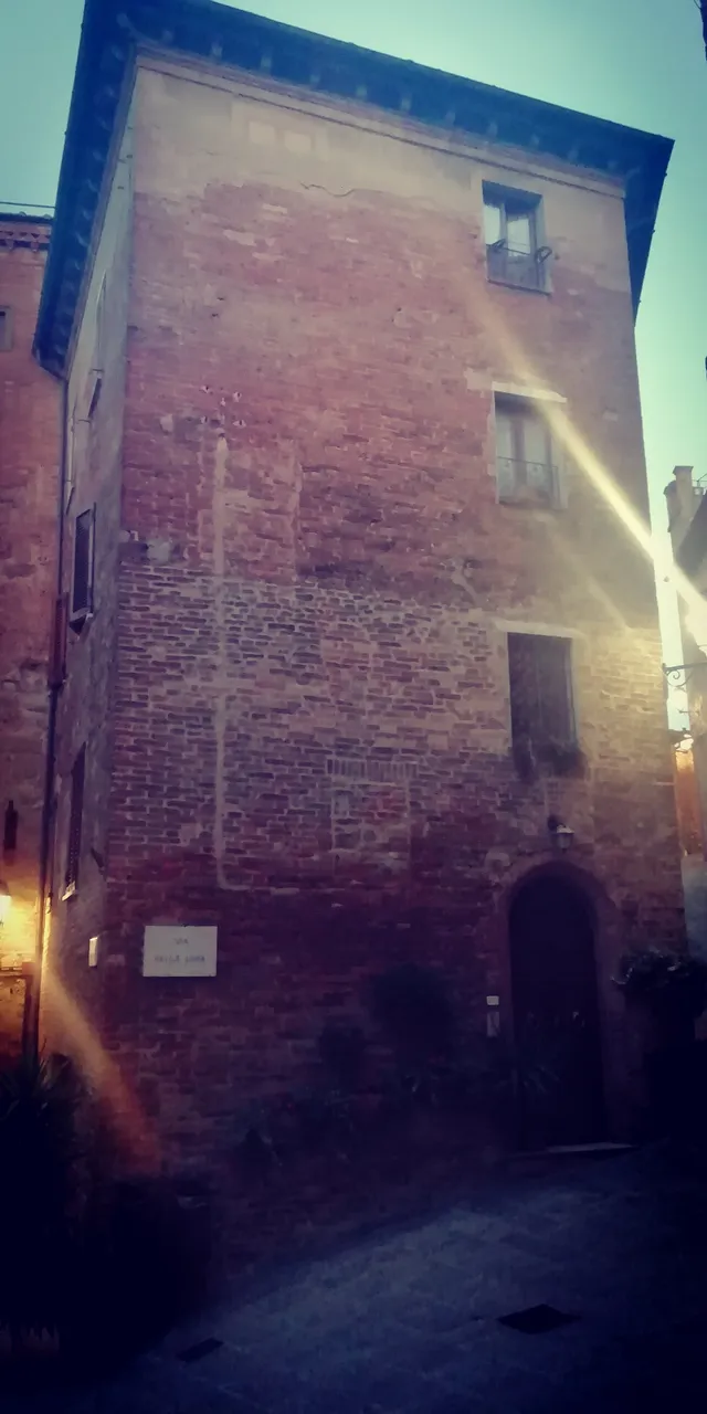 The house with the typical rock of Siena with the typical colors of Tuscany.