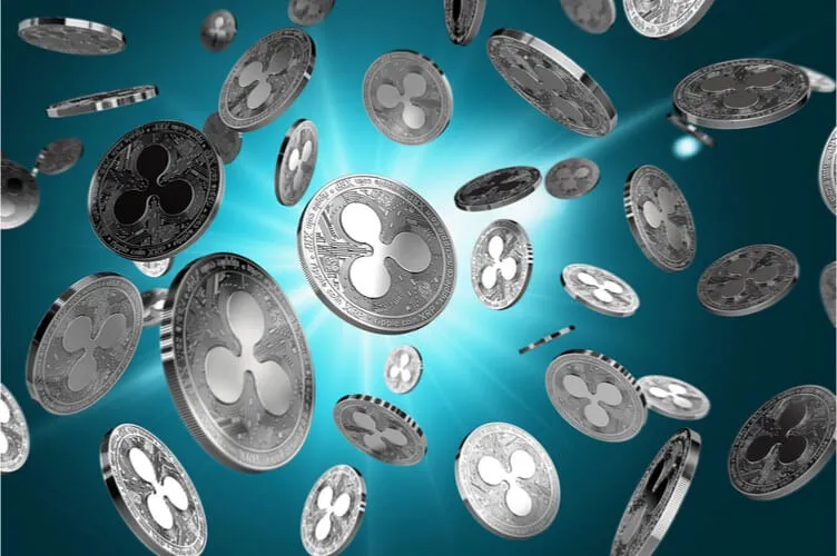 Scattered Ripple coins on a lighted background.jpg