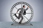 stock-photo-businessman-running-on-hamster-wheel-582227104.jpg