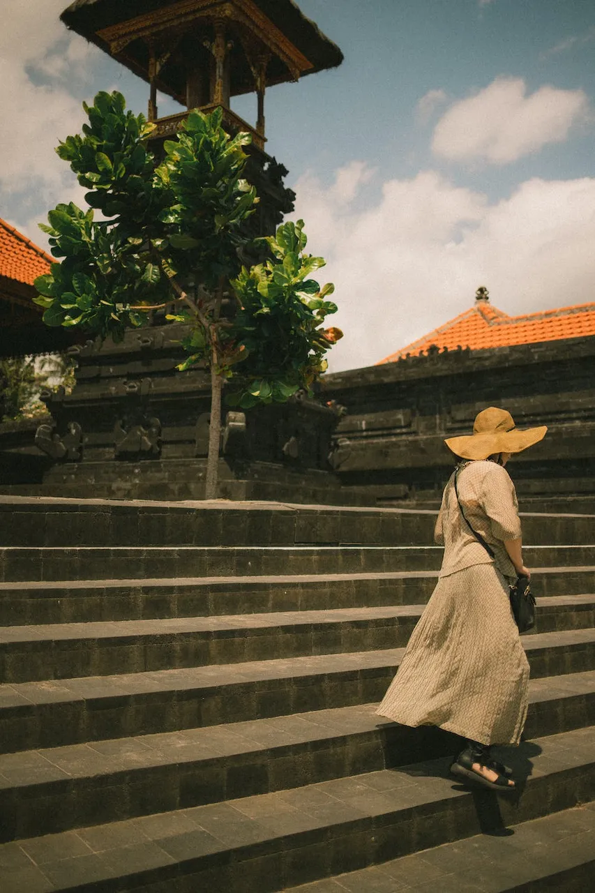 free-photo-of-woman-descending-steps-in-front-of-a-small-tower.jpeg