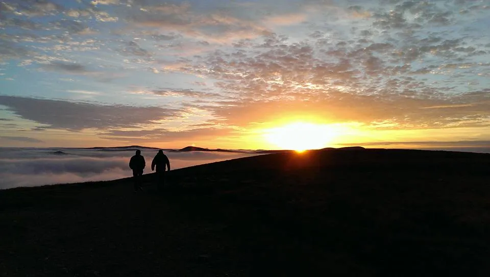 two lads walking by sea of clouds on Djouce.jpg