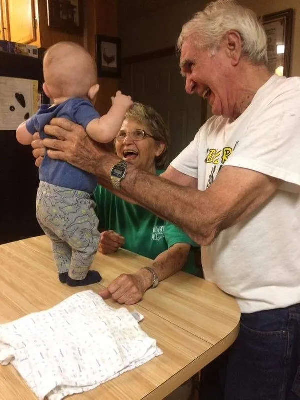 Granny and paw paw playing with my nephew caisen